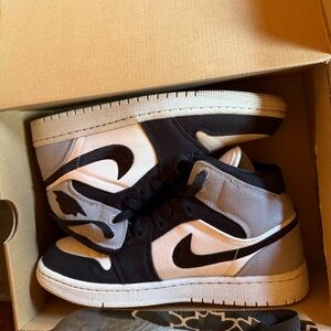 Jordan women’s Black and Light Gray High Top Athletic Shoes